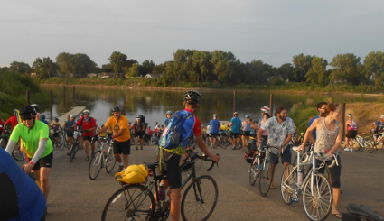 rear wheels in the Missouri River Dip Site as riders gather to start